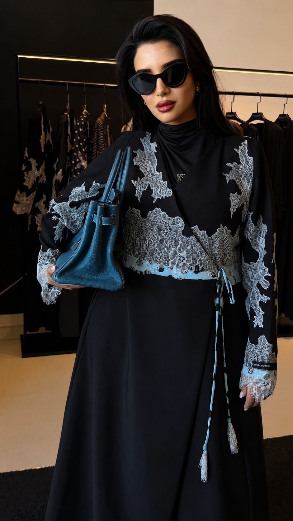 Crêpe Dentelle abaya in black with light blue lace, front view