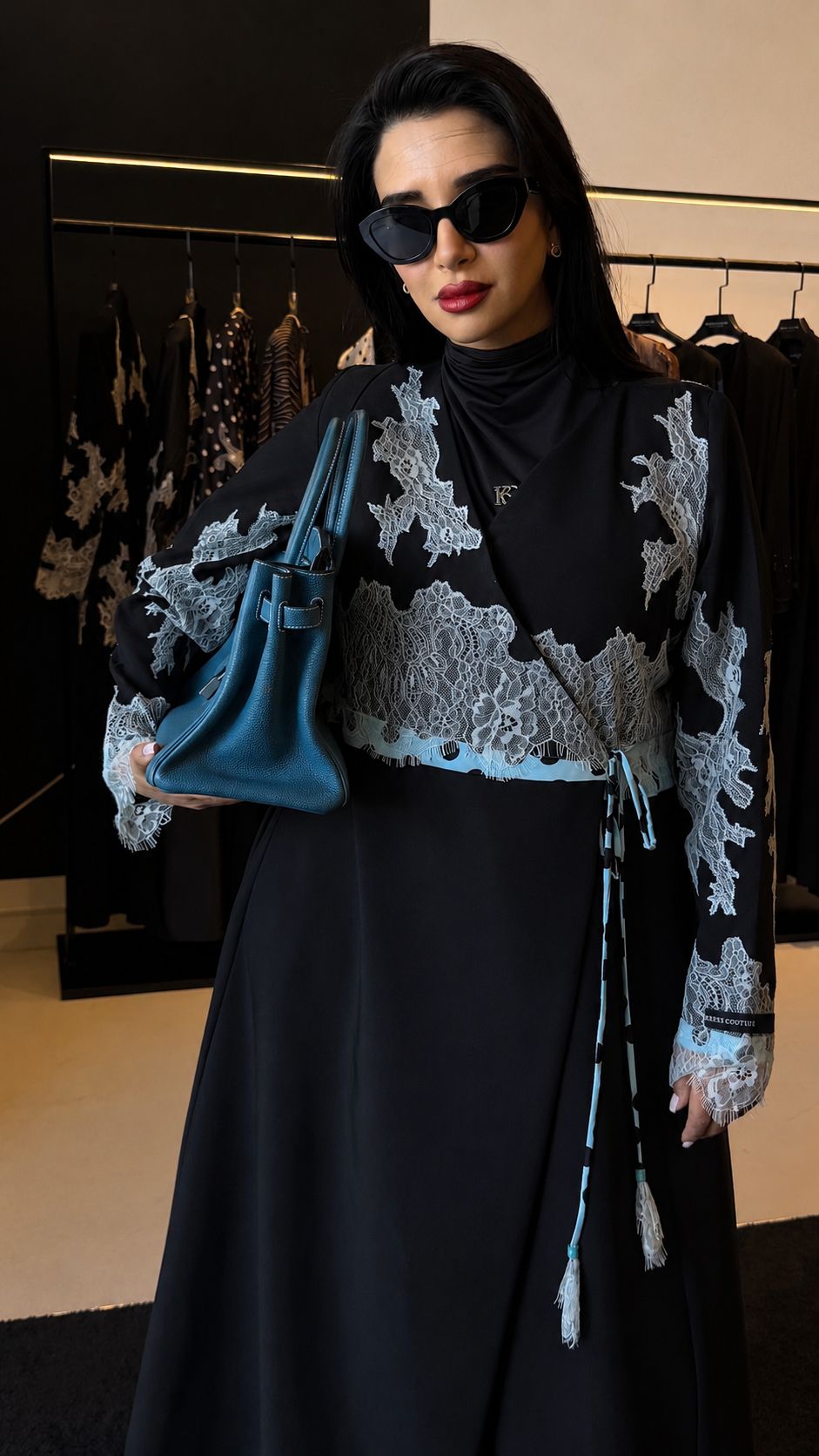 Crêpe Dentelle abaya in black with light blue lace, alternate front view