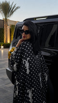 Pois Dentelle black abaya with white polka dots and lace, back view