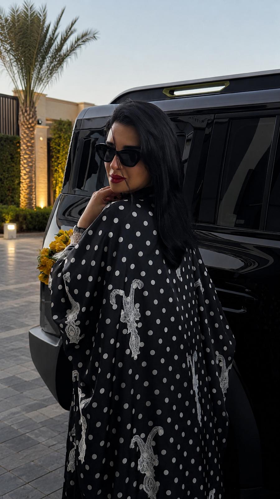 Pois Dentelle black abaya with white polka dots and lace, back view